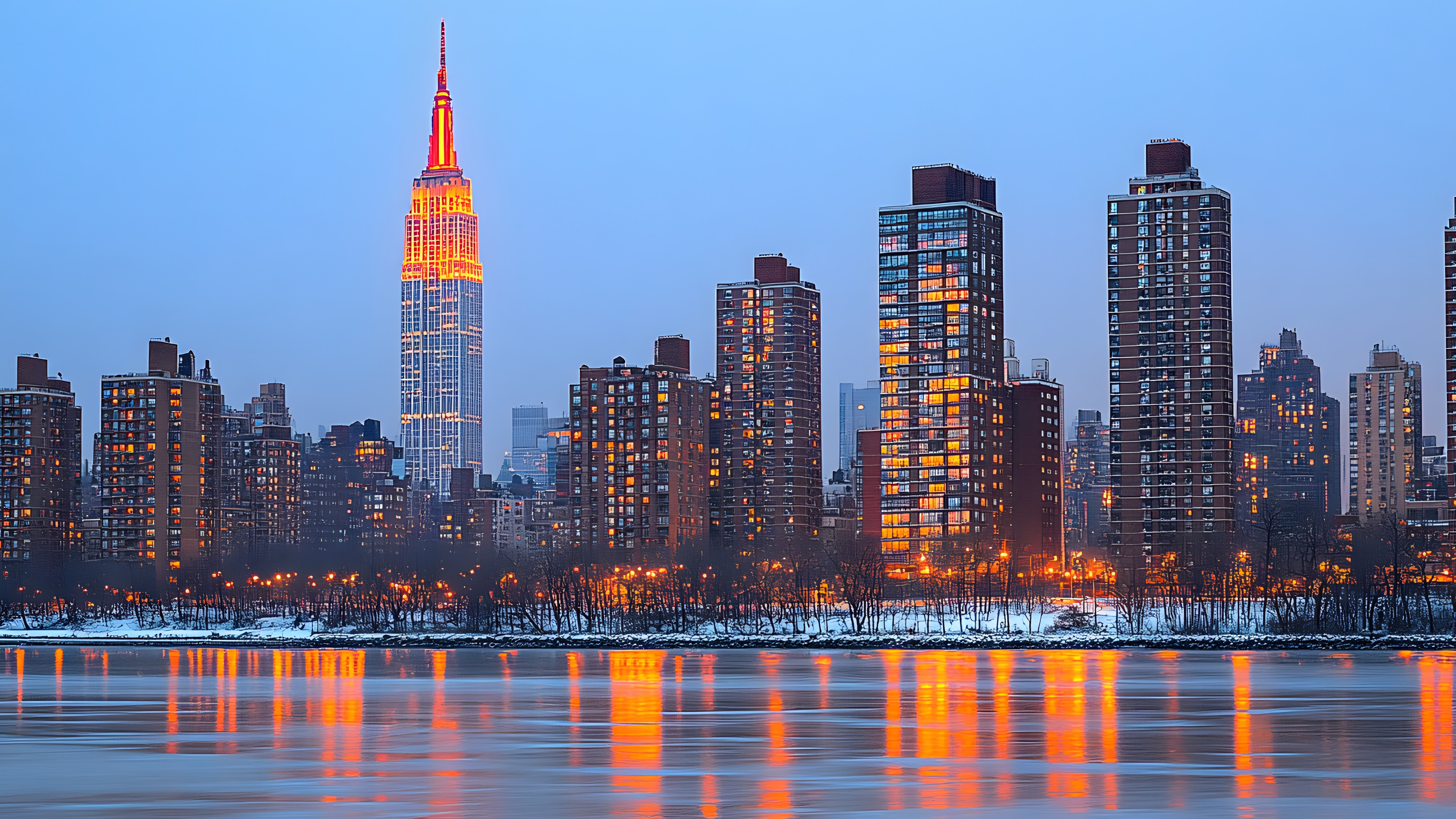 Water, Skyscraper, Building, Sky, Daytime, Tower block, Tower, Cityscape, Dusk, Condominium, City, Horizon, Metropolitan area, Metropolis, Commercial building, Mixed-use, Liquid, Downtown, Reflection, Art