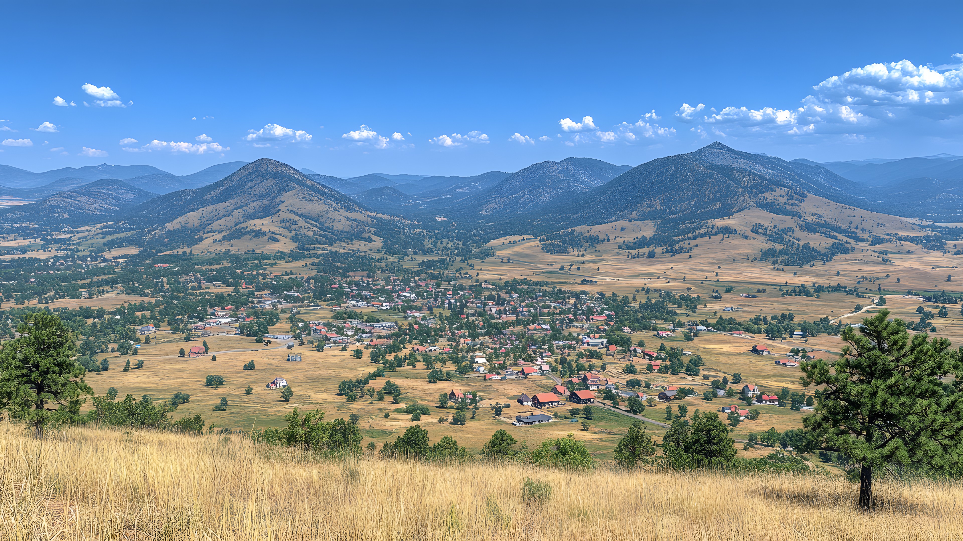 Mountainous landforms, Mountain, Hill, Highland, Mountain range, Landscape, Ecoregion, Cloud, Grassland, Hill station, Rural area, Plain, Ridge, Valley, Meadow, Slope, Fell, Pasture, Prairie, Summit