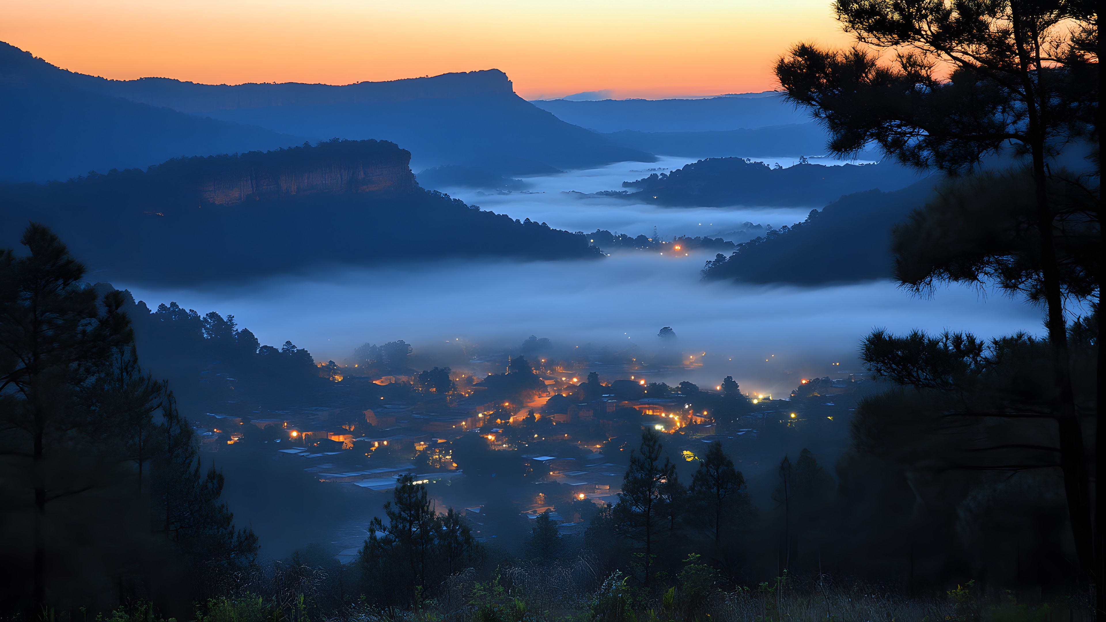 Mountainous landforms, Mountain, Hill, Natural landscape, Highland, atmospheric phenomenon, Sunrise, Dusk, Hill station, Mountain range, Valley, Evening, Forest, Morning, Sunset, Sunlight, Afterglow, Mist, Jungle, Ridge