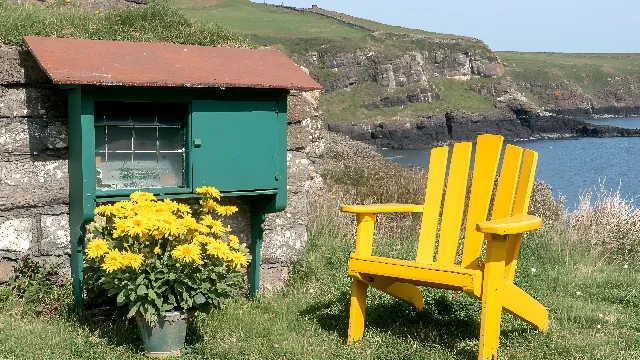 Yellow, Coast, Outdoor furniture, Sea, Ocean, Headland, Island, Bay, Outdoor Bench, Wildflower, Armrest, Raised beach, Promontory, Cinquefoils