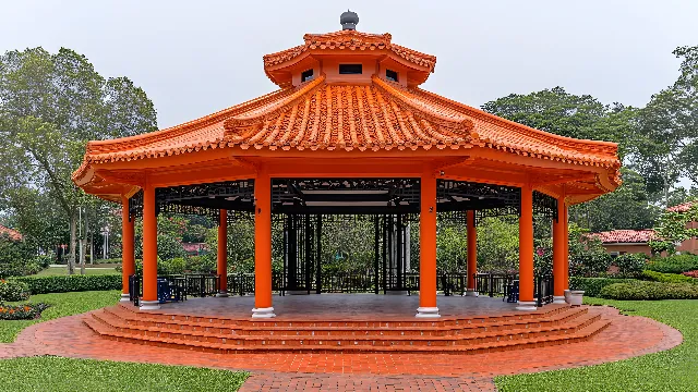 Plant, Sky, Tree, Shade, Gazebo, Outdoor structure, Building, Temple, Leisure, Roof, Event, Chinese architecture, Grass, Landscaping, Garden, Place of worship, Shrub, Building material, Japanese architecture, Facade