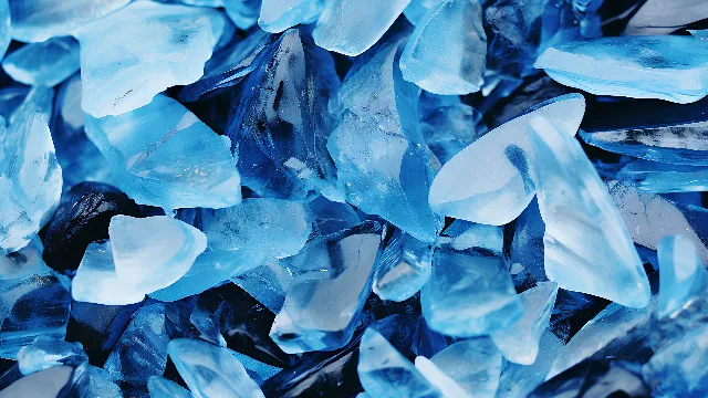 Blue, Azure, Natural material, Petal, Aqua, Electric blue, Pattern, Groundcover, Close-up, Transparent material, Fashion accessory, Rock, Symmetry, Freezing, Art, Crystal