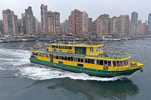 Boat, Mode of transport, Transport, Watercraft, High-rise building, Skyscraper, City, Public transport, Metropolitan area, Metropolis, Naval architecture, Ship, Channel, Condominium, Apartment, Cityscape, Ferry, Travel, Tower, Water transportation